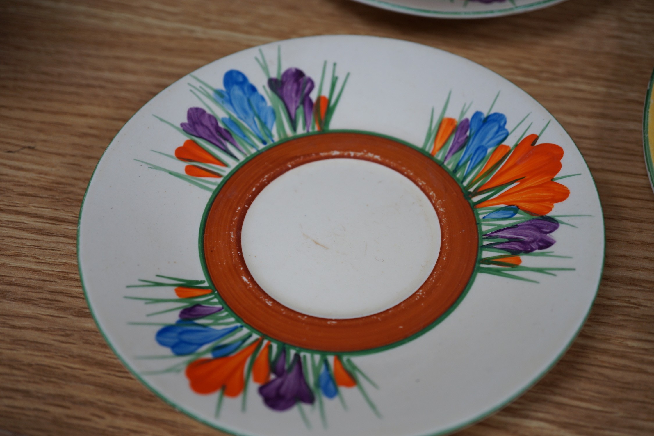 A Clarice Cliff seventeen piece Autumn Crocus part teaset, including a preserve jar and cover